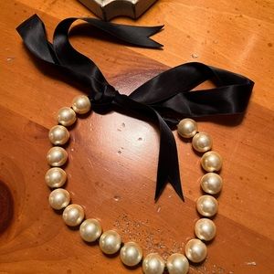 Cute pearl necklace with black ribbon